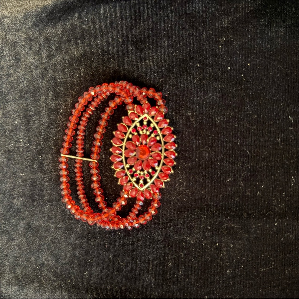 Elegant Red Beaded Bracelet with Floral Accent